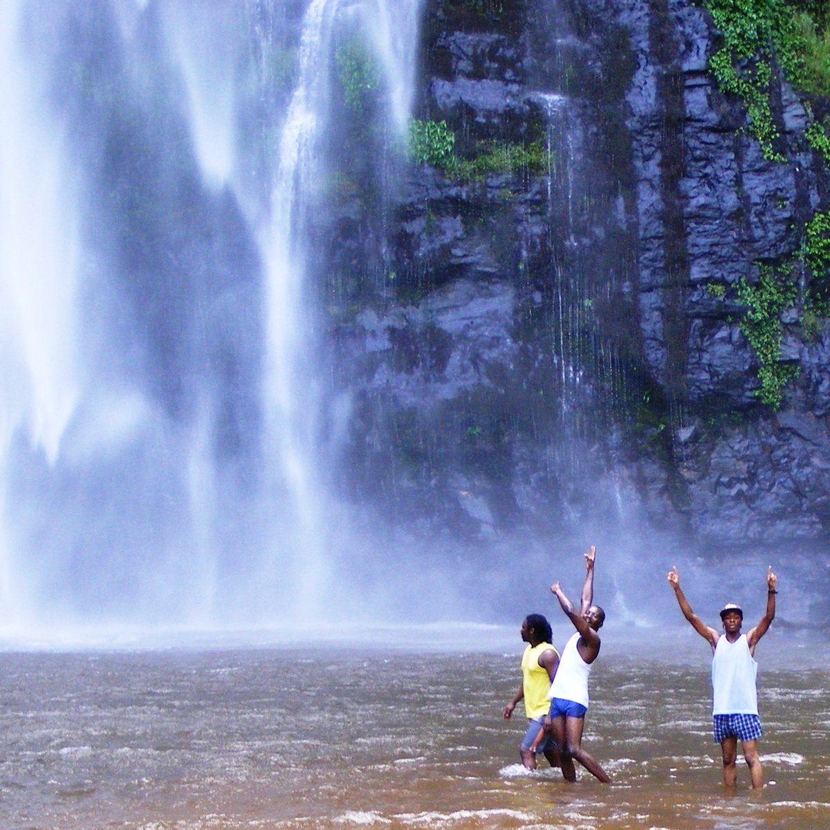 Waterfalls Day Trip Guests and guide in the pool below Wli Falls