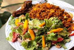 Jollof rice with salad, Ghana-style