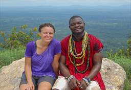 Smiling woman and guide at summit of Mt Afadjato