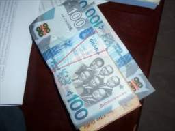 stack of 100 cedi notes